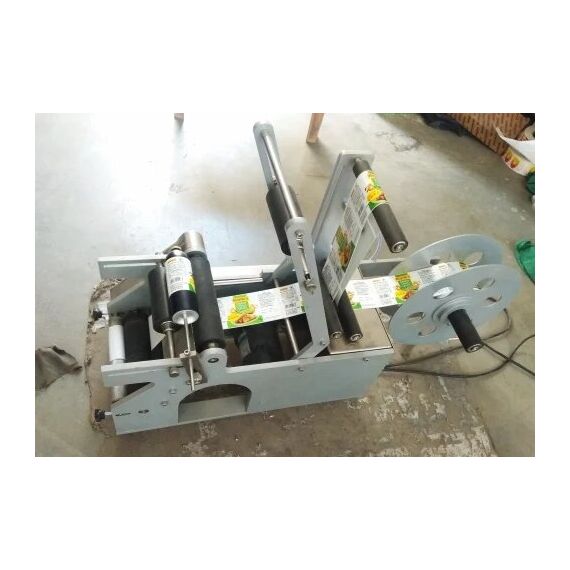 SEMI-AUTOMATIC SURFACE LABELING MACHINE WITH VACUUM PUMP SYSTEM